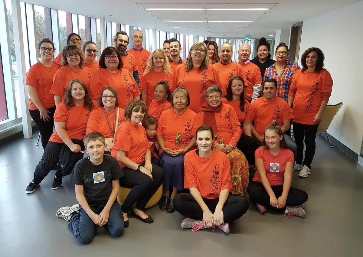 A group of staff wearing orange shirts for the National Day for Truth and Reconciliation.