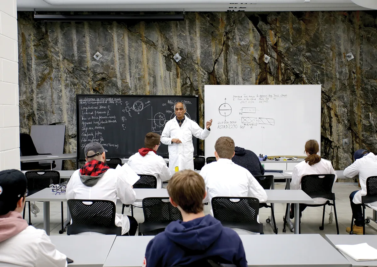 Professor delivering lecture to students in classroom