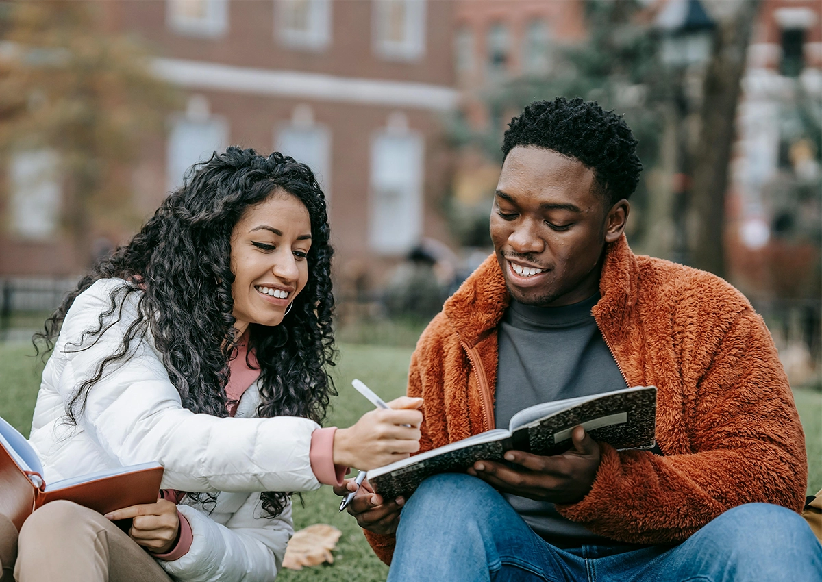 Students studying together outside.