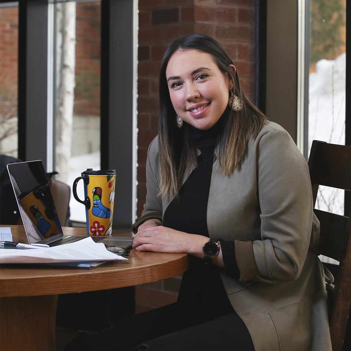 An Indigenous Laurentian University student studying in the J.N. Desmarais Library.