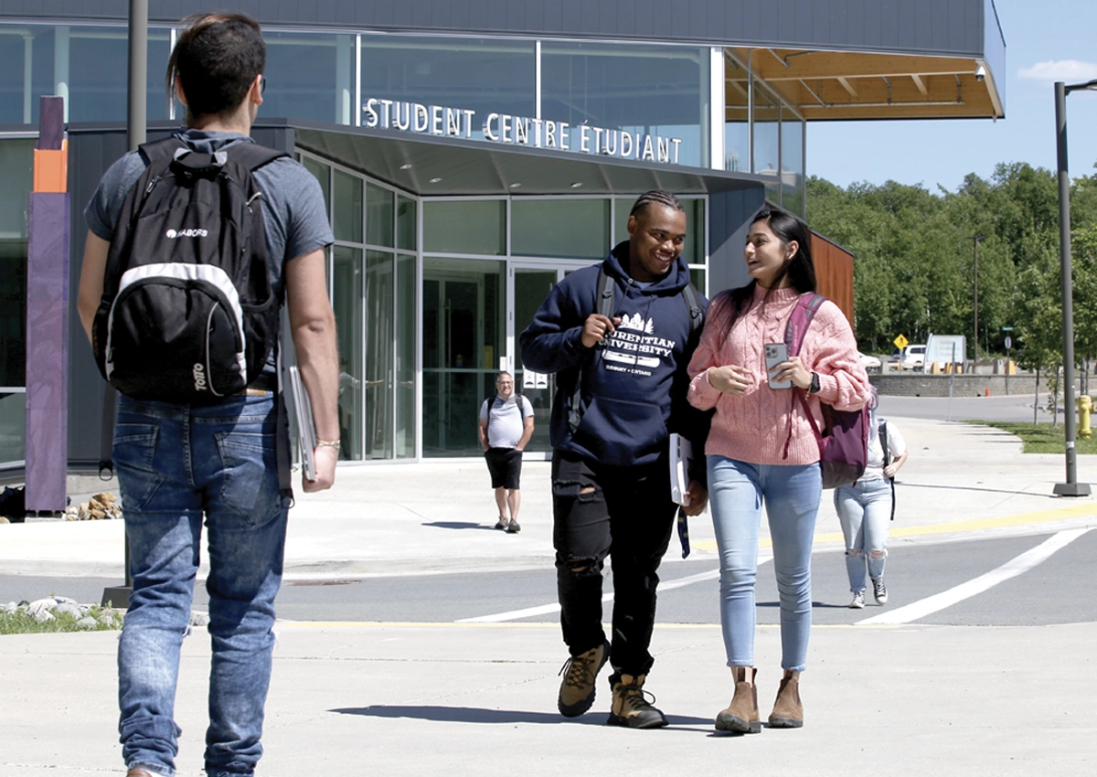 Laurentian students walking in front of the Student Centre.