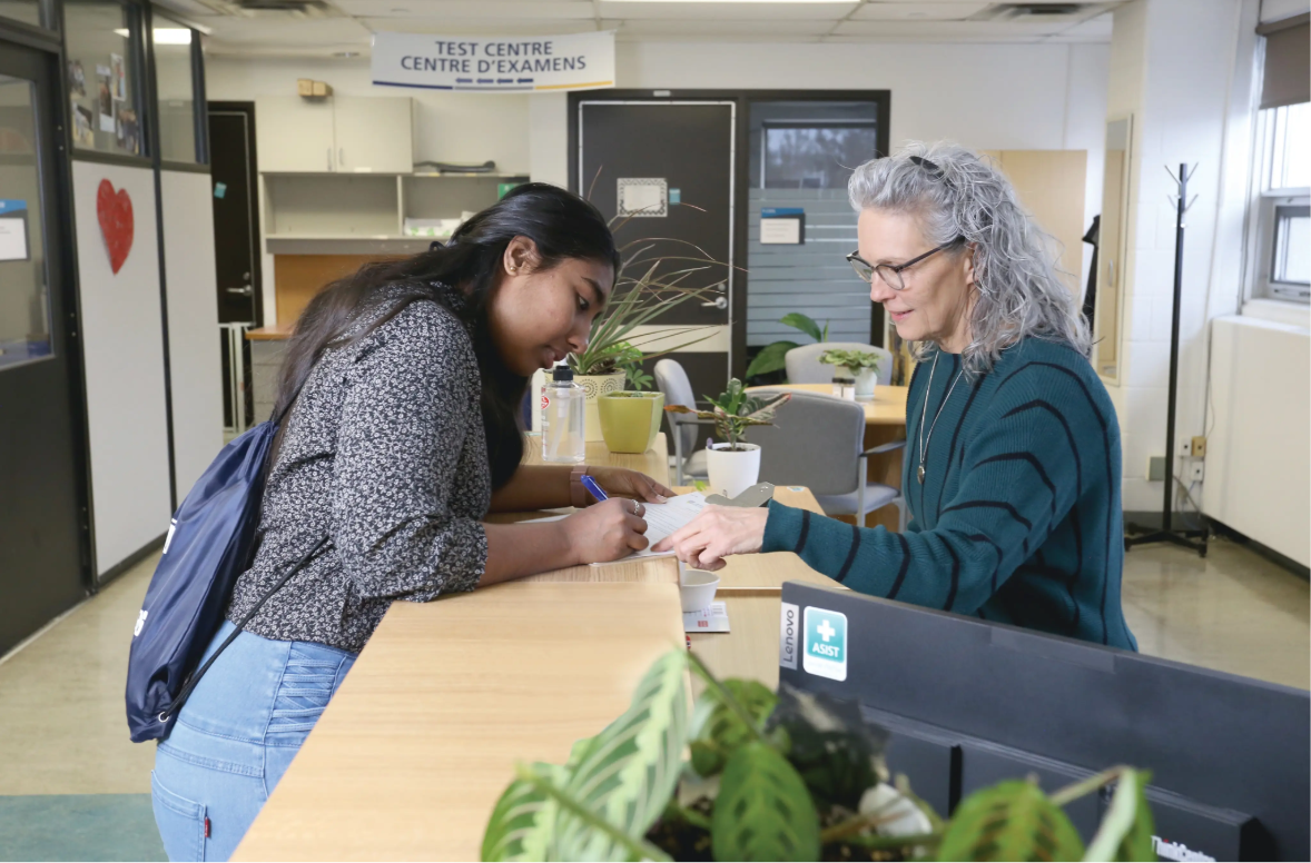 The Accessibility Services intake coordinator greets a student at the front desk