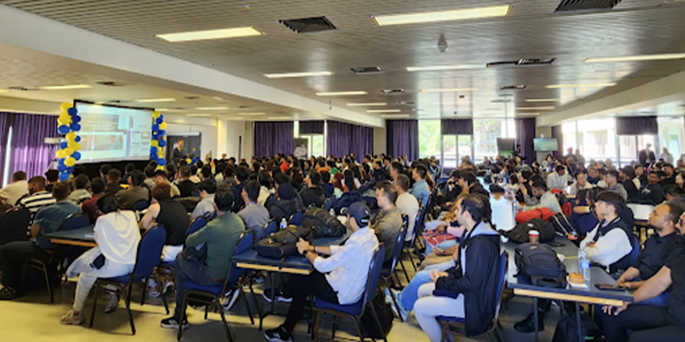 Students in a class looking at presentation