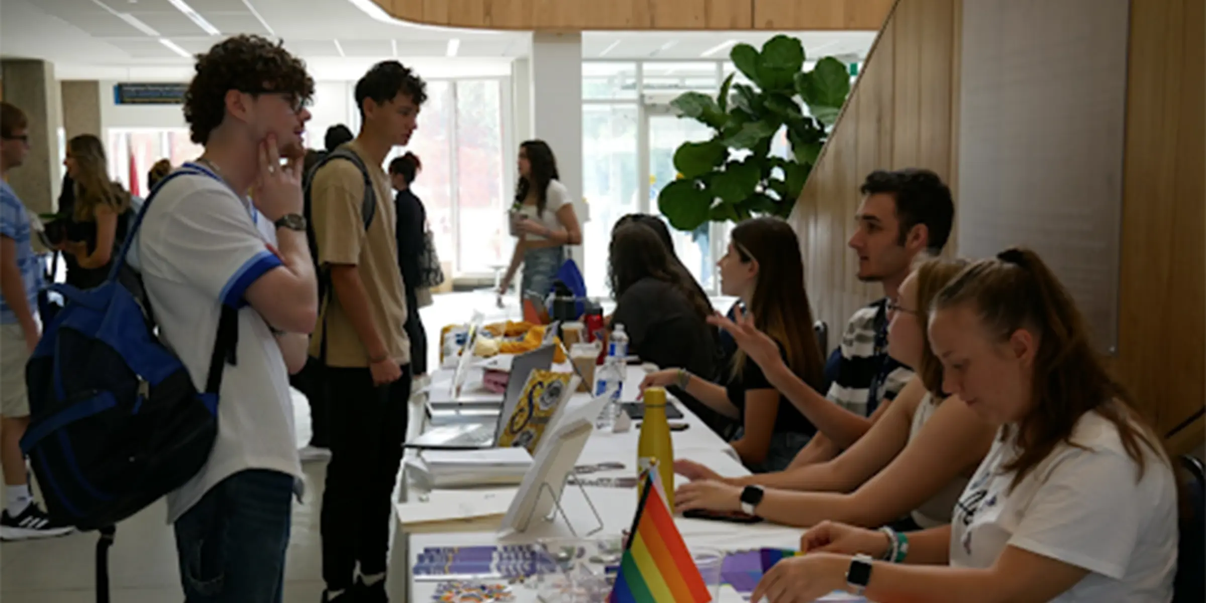 Students at a table during pride