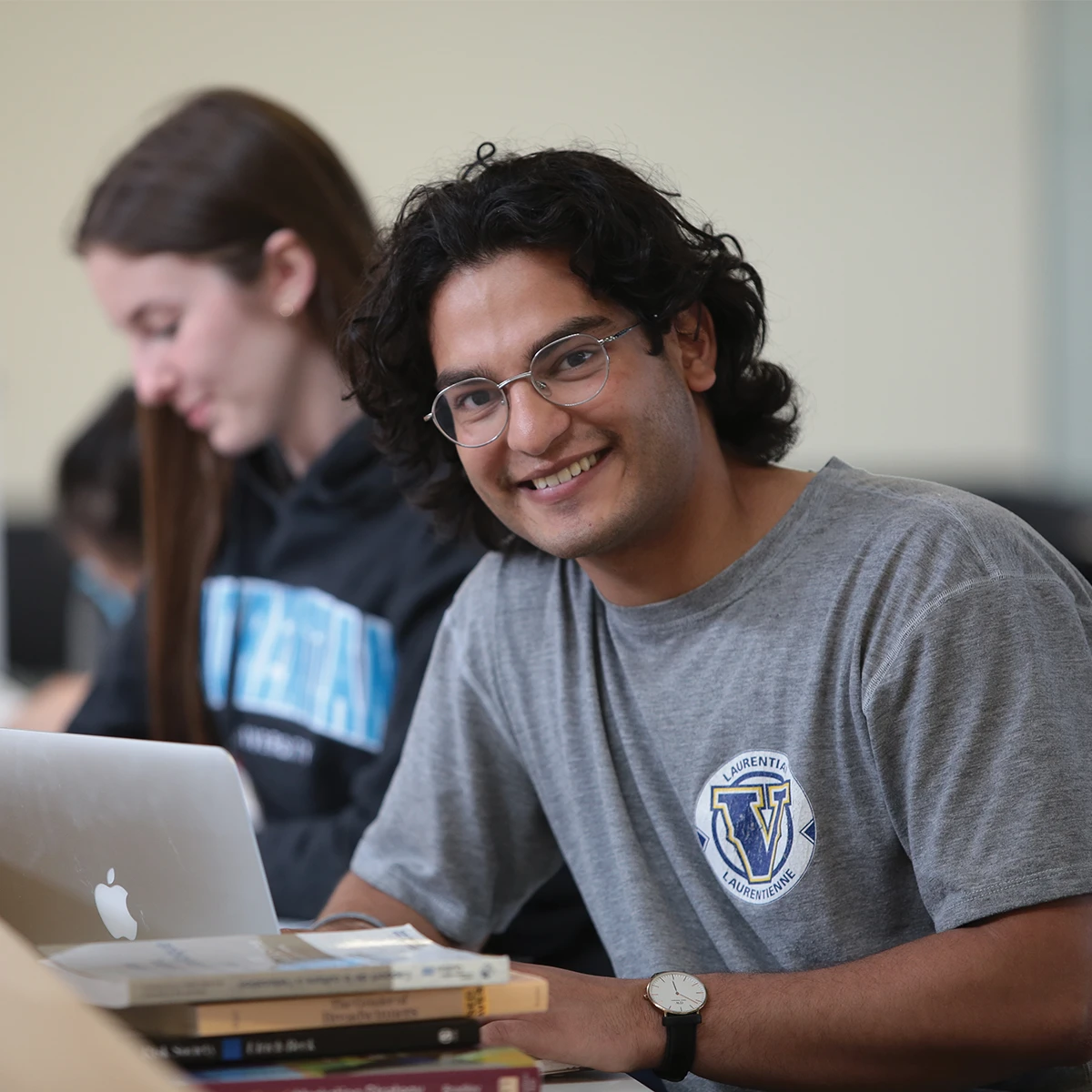 A Laurentian University student studying on campus.