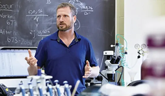 Professor Thomas Merritt teaching a lecture.