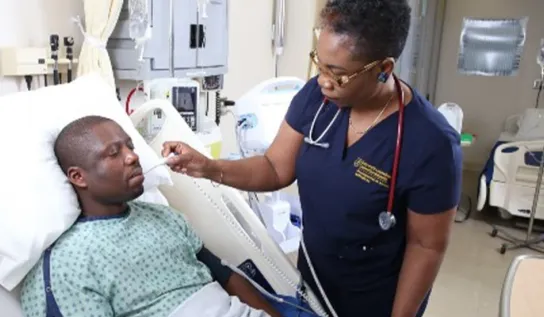 a nurse taking a patient's temperature
