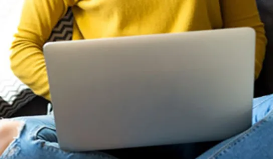 A person using a laptop.