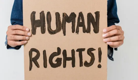 Man holding up a sign saying Human rights