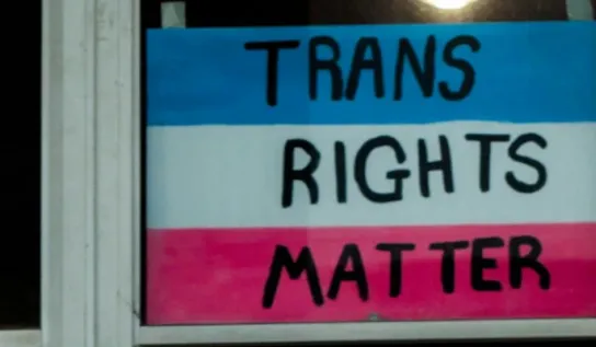 Trans Rights Matter written on paper in a window
