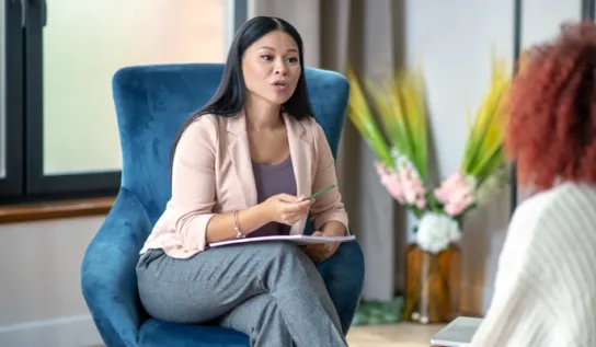 A psychologist giving therapy services to a patient.