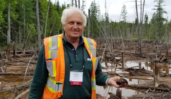 Peter Beckett standing in a wetland
