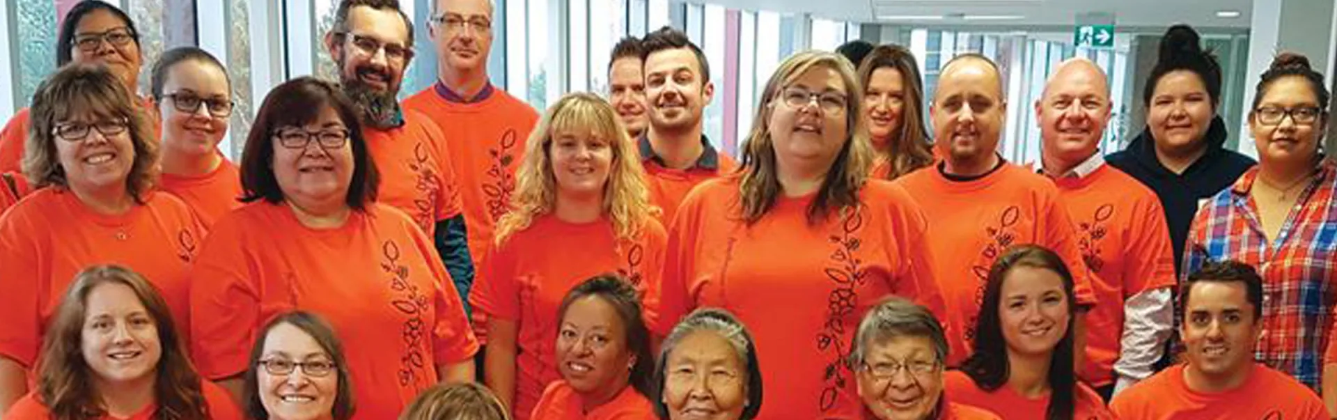 A group of people wearing orange for the National Day for Truth and Reconciliation.