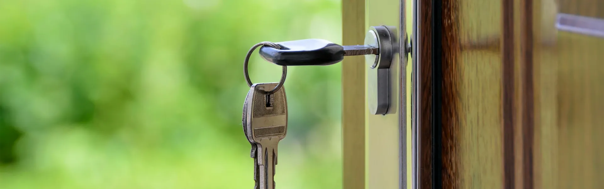 A set of keys in a door lock.