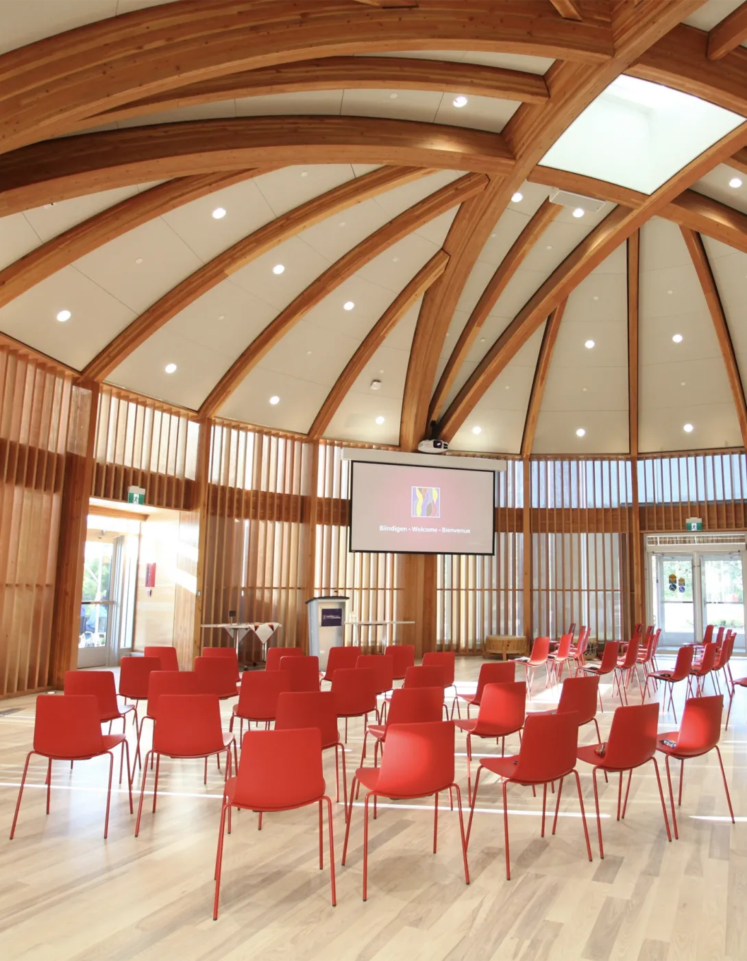 The Indigenous Sharing and Learning Centre Round Room, with red chairs arranged in rows in the middle of the room.