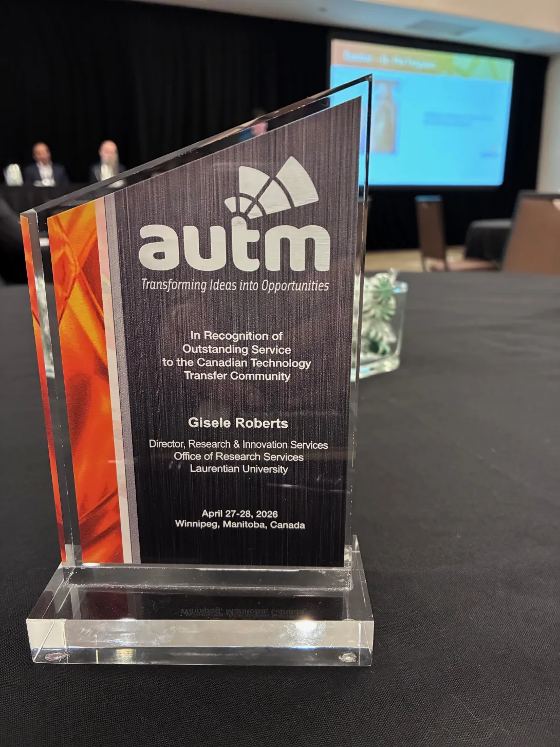 A close-up of the AUTM Canadian Award presented to Gisele Roberts in Winnipeg, Manitoba, recognizing her outstanding service to the technology transfer community.